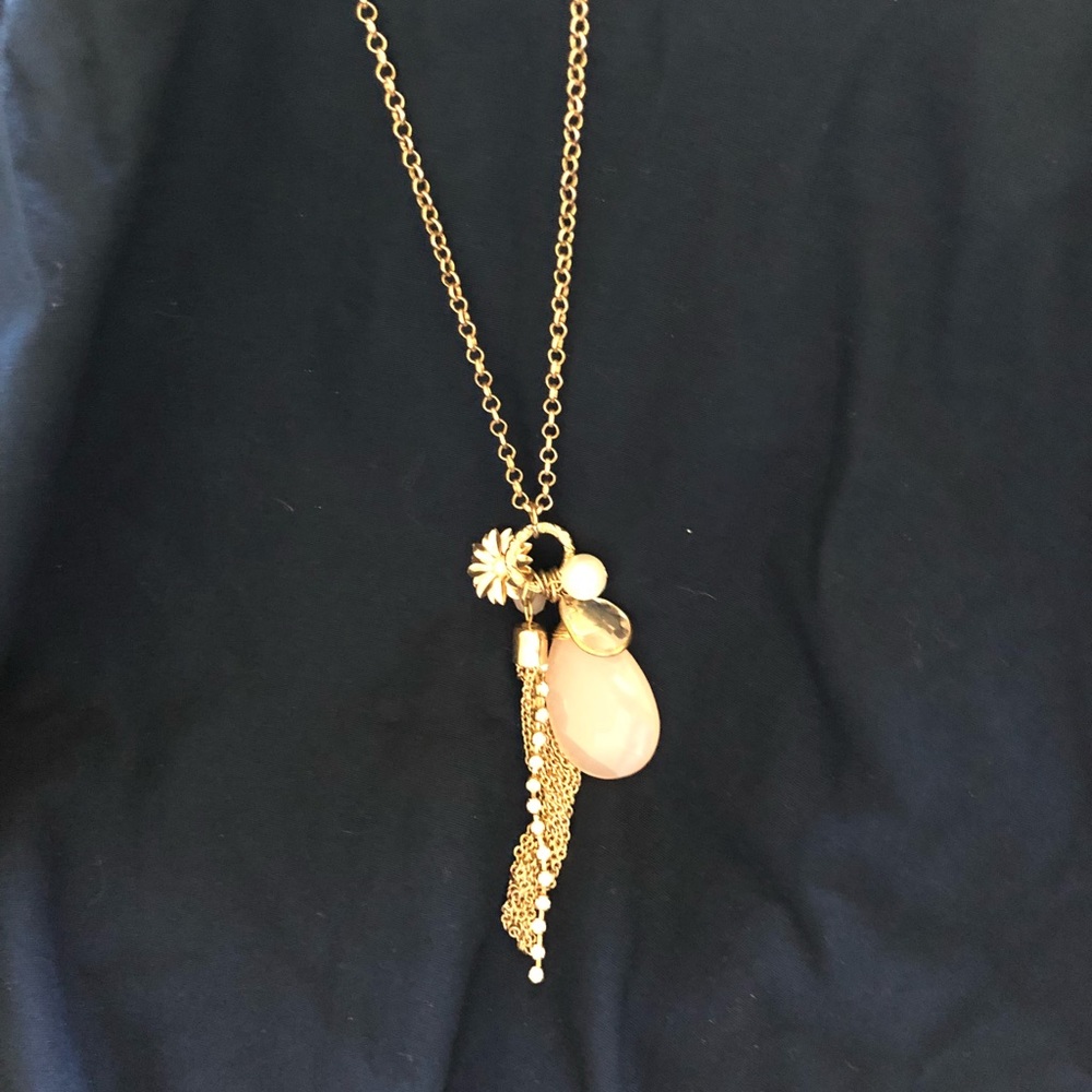 Gold necklace with large pink jewel